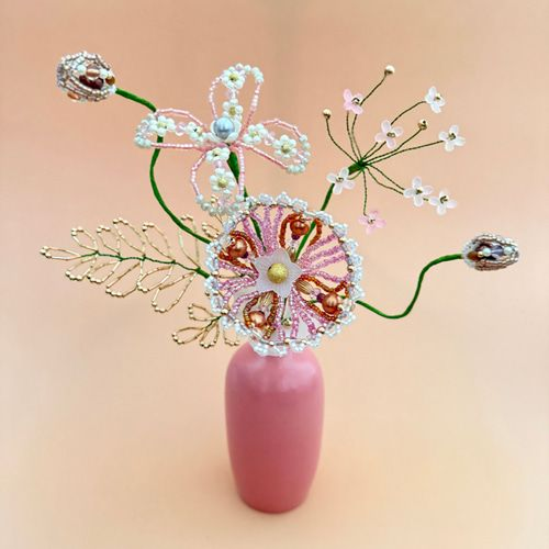 Medium white and pink beaded flower bouquet in pink vase